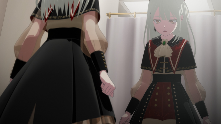 Mutsumi looks at herself in the mirror, experiencing a dissociative breakdown